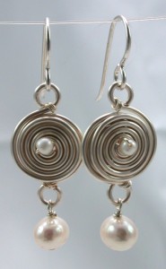 These earrings are made with silver art wire, sterling headpins/earwires and pearls.
